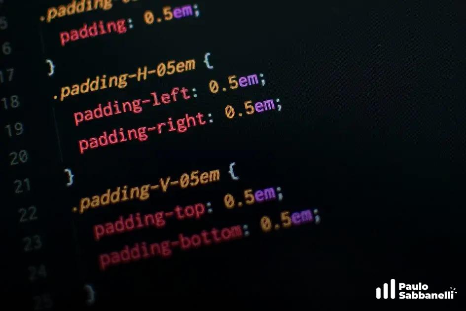 Close-up de código CSS em rosa e ciano definindo classes de espaçamento padding em fundo escuro