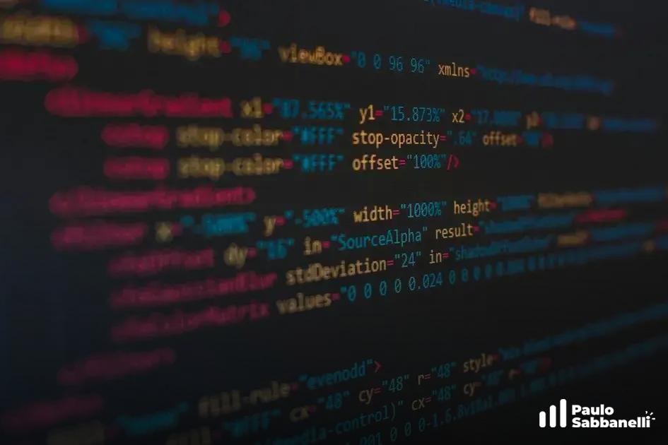 Código desfocado com definições de gradiente SVG e efeito de desfoque gaussiano em azul e vermelho